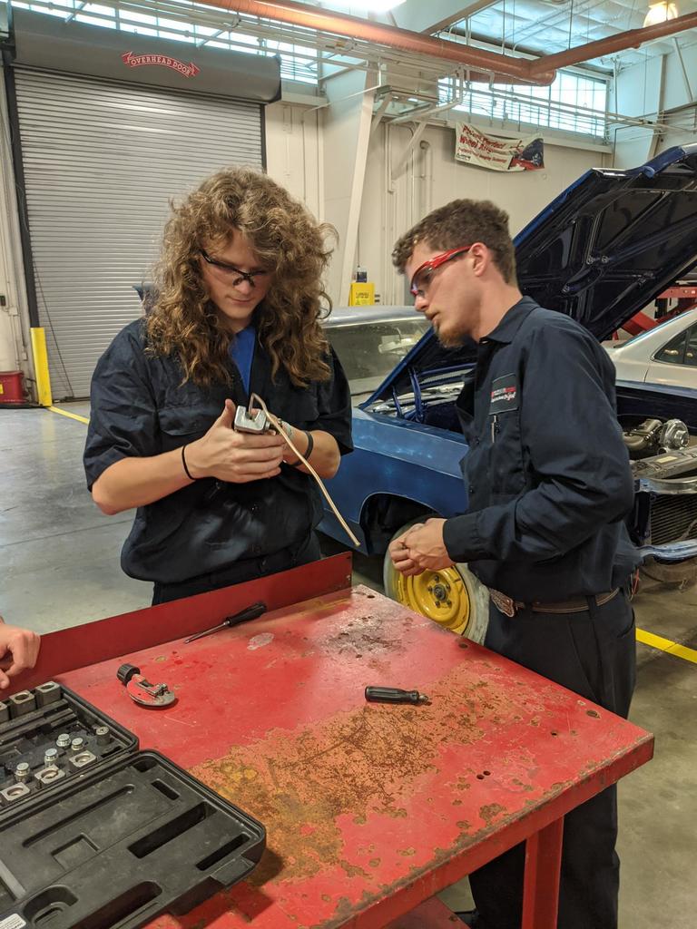 Auto students working