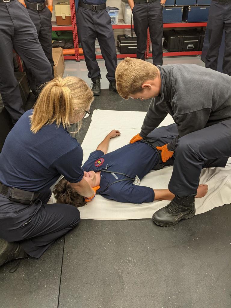 Fire students checking vitals