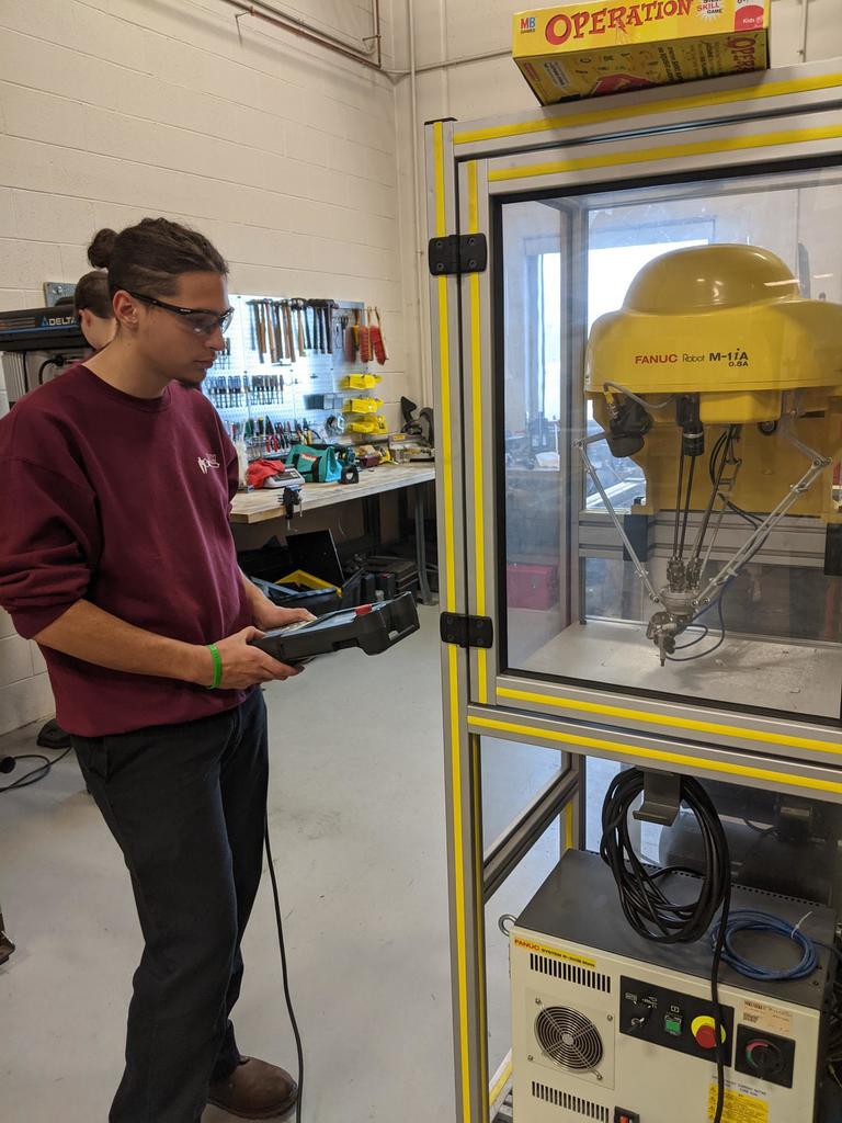 student working with robot